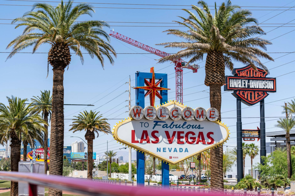 A bustling scene outside an In-N-Out Burger location in Las Vegas, highlighting the iconic sign. — iconic burgers Las Vegas