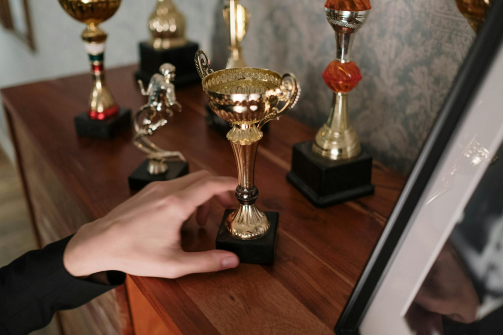 A celebratory photo of a winner holding up their trophy or plaque from the contest. — burger challenges Las Vegas