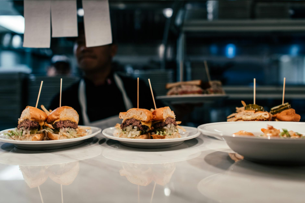 A chef preparing vegan sliders in a busy Las Vegas kitchen — vegan cheeseburger sliders Las Vegas