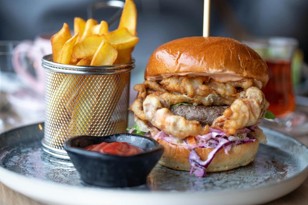 A close-up of a delicious, kid-friendly burger with fries. — family-friendly burgers Las Vegas
