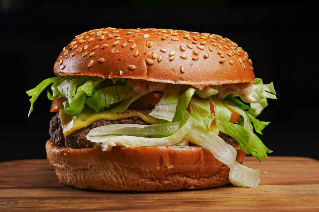 A close-up of a juicy burger with fresh ingredients, perfect for showcasing the best burger joints Las Vegas