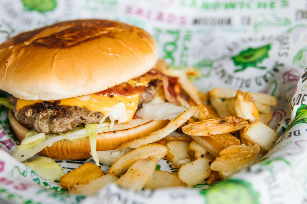 A close-up shot of a mouth-watering vegan burger with a side of sweet potato fries. — vegan burgers Las Vegas