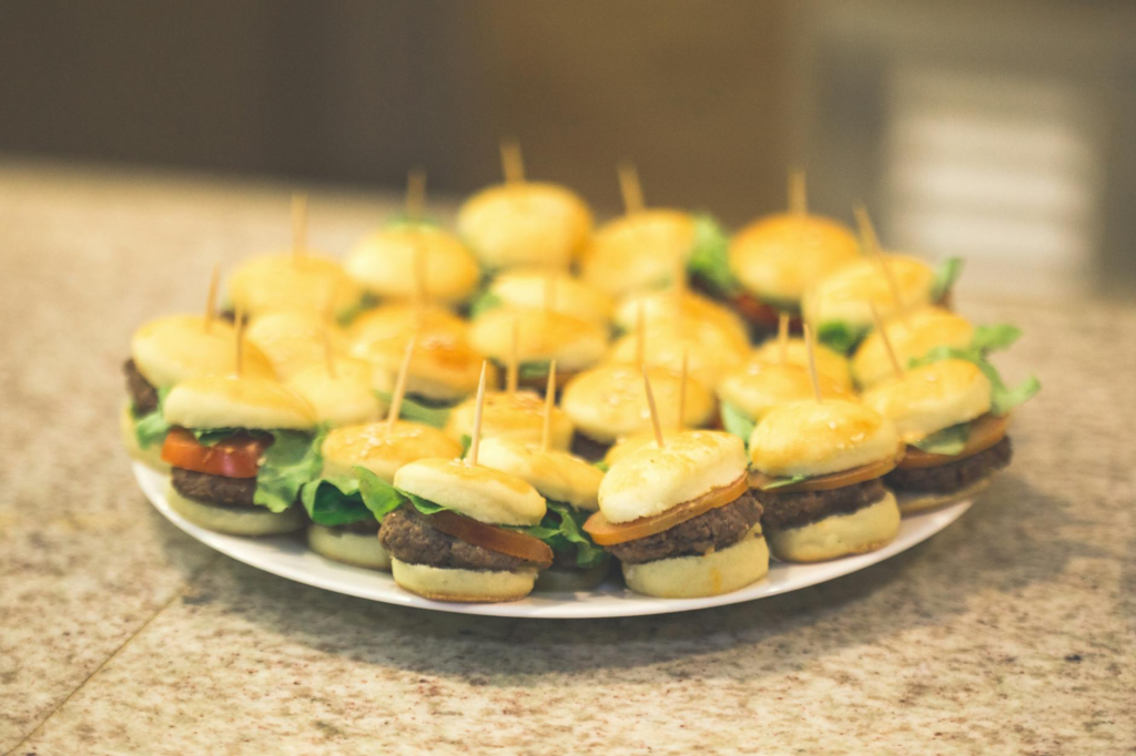 A colorful plate showcasing various vegan slider options including vegan cheeseburger sliders Las Vegas