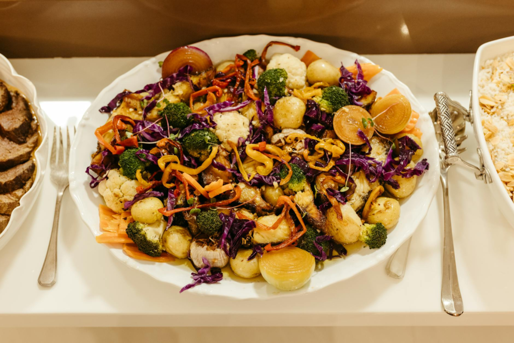 A colorful platter of various vegan dishes, including burgers, salads, and desserts. — vegan burgers Las Vegas