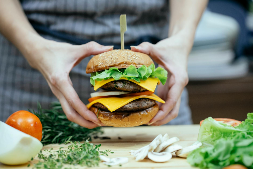 A colorful spread of ingredients for cheeseburger sliders on a kitchen counter. — family cooking cheeseburger sliders