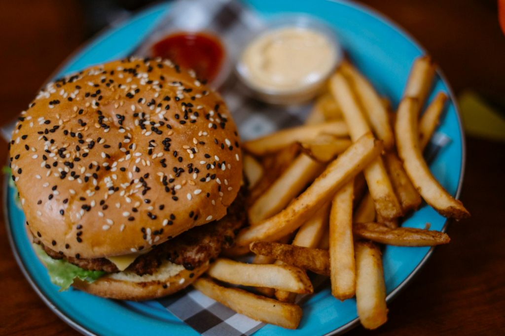 A delicious cheeseburger with fresh toppings and a side of fries from a local Las Vegas eatery. — burger deals Las Vegas