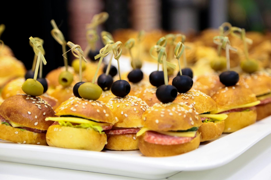 A festive burger platter with various toppings and drinks in the background. — Pairing Drinks Holiday Burgers Las Vegas