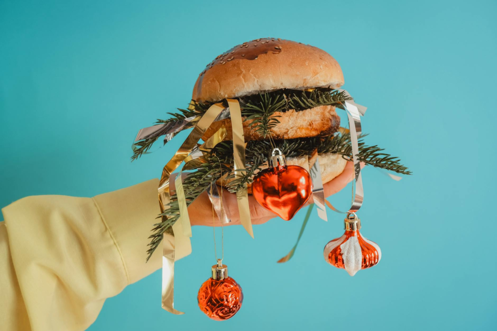 A festive holiday-themed burger with colorful toppings and decorations. — Celebrity Chef Holiday Burgers Las Vegas
