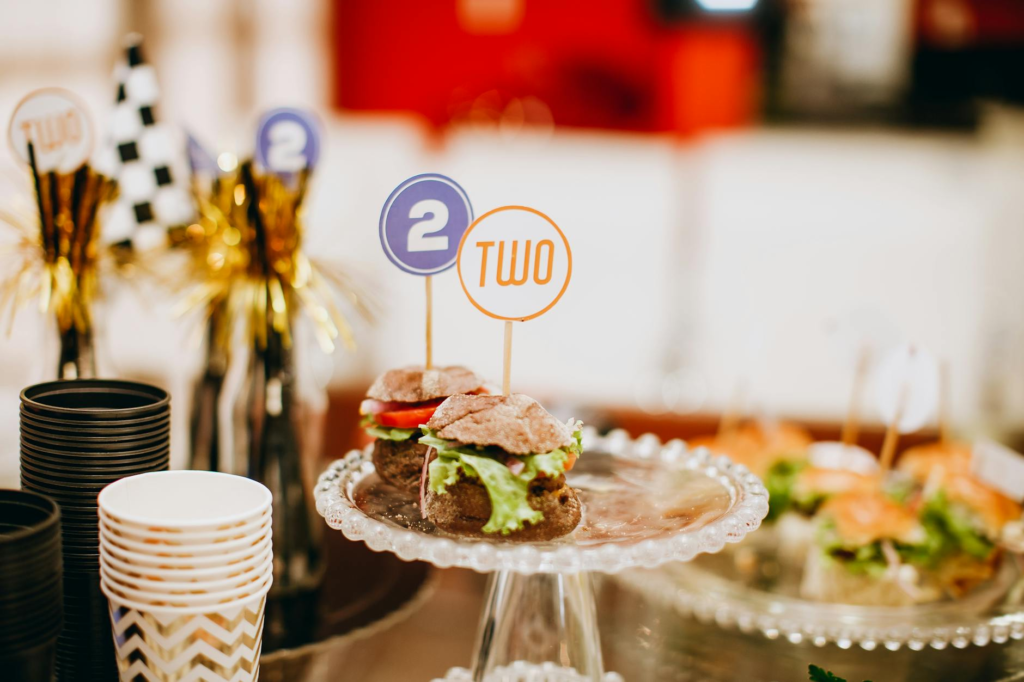 A festive table setting with cheeseburger sliders as the centerpiece. — cheeseburger sliders vs burgers