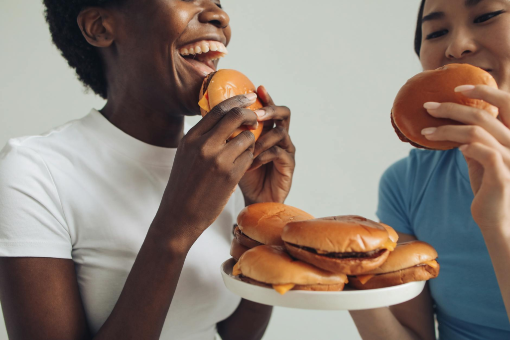 A friendly group of friends enjoying burgers and drinks together — best burgers in Las Vegas