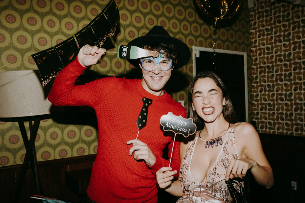 A fun holiday photo booth with props at a burger party. — Host Holiday Burger Party Las Vegas