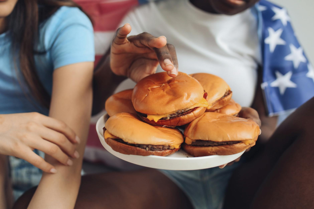 A group of friends enjoying holiday celebration burgers at a Las Vegas eatery. — Holiday Celebration Burger Styles Las V…