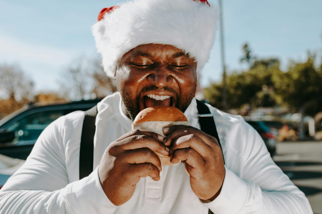 A group of happy diners enjoying celebrity chef burgers during the holiday season. — Celebrity Chef Holiday Burgers Las …