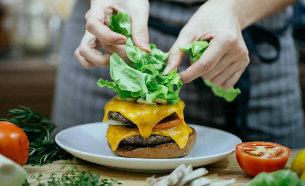 A plate of healthy cheeseburger sliders with fresh vegetables