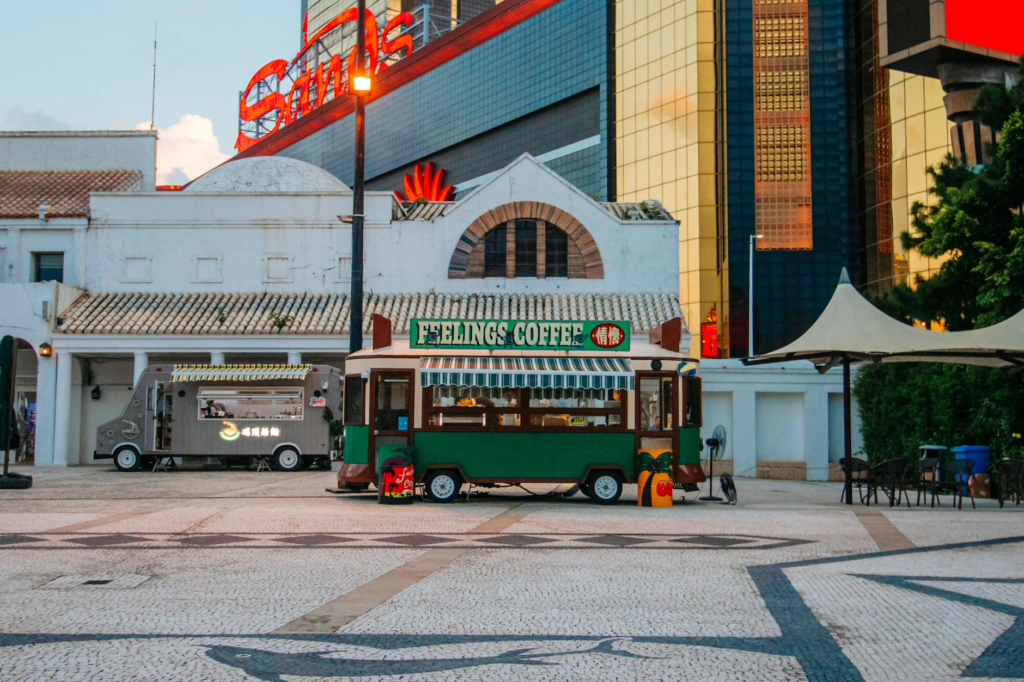 A vibrant food truck park filled with various food trucks featuring cheeseburger slider food trucks Las Vegas