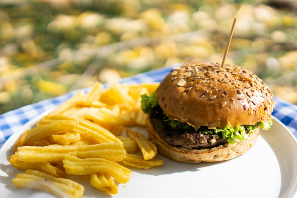 A vibrant plate of fries and a burger, highlighting the perfect pairing for a meal. — best burger joints Las Vegas