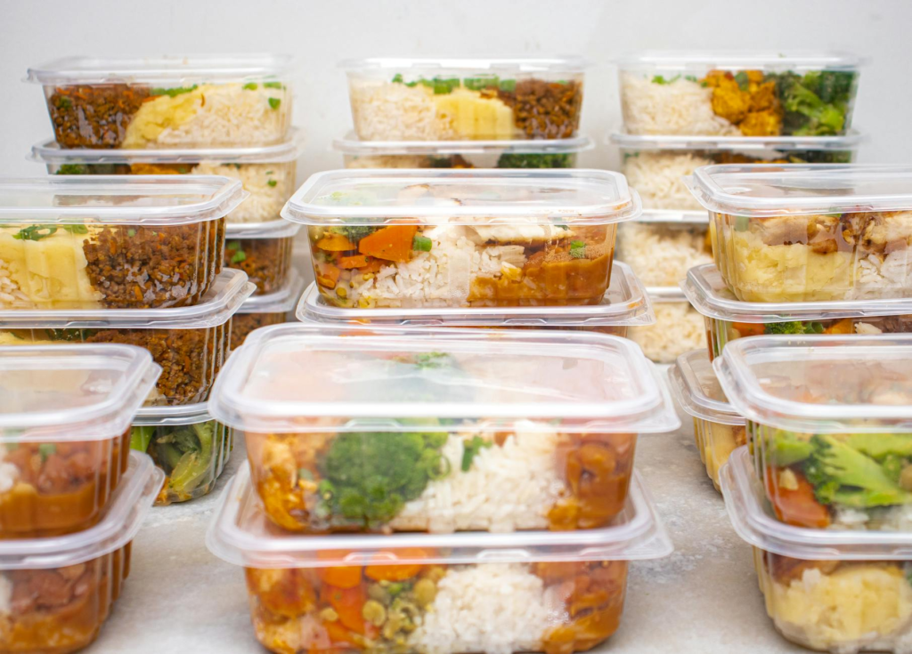 An organized meal prep container filled with cheeseburger sliders. — cheeseburger slider meal prep