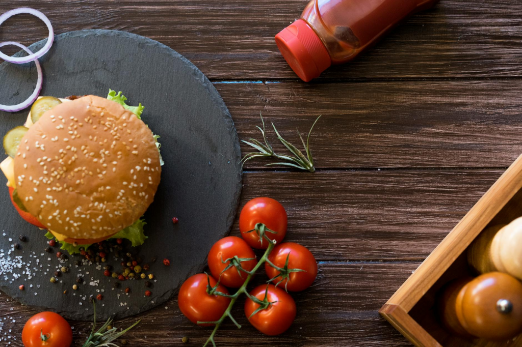 An overhead view of the ingredients laid out for homemade cheeseburger sliders. — cheeseburger sliders recipe