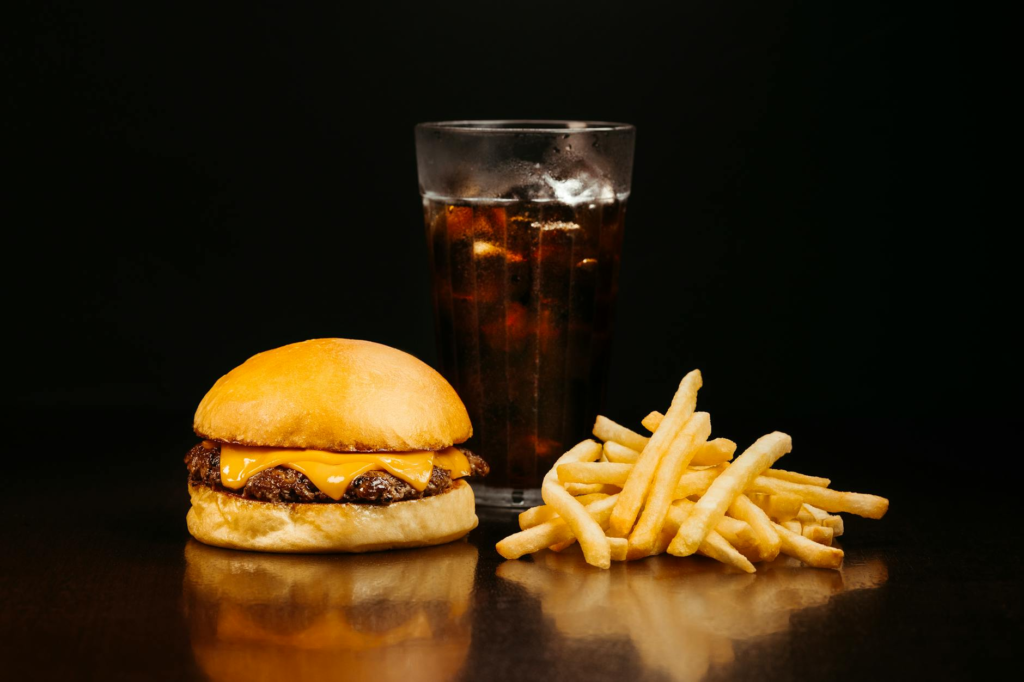Close-up of a kids burger served with fries and a drink. — family-friendly burgers Las Vegas