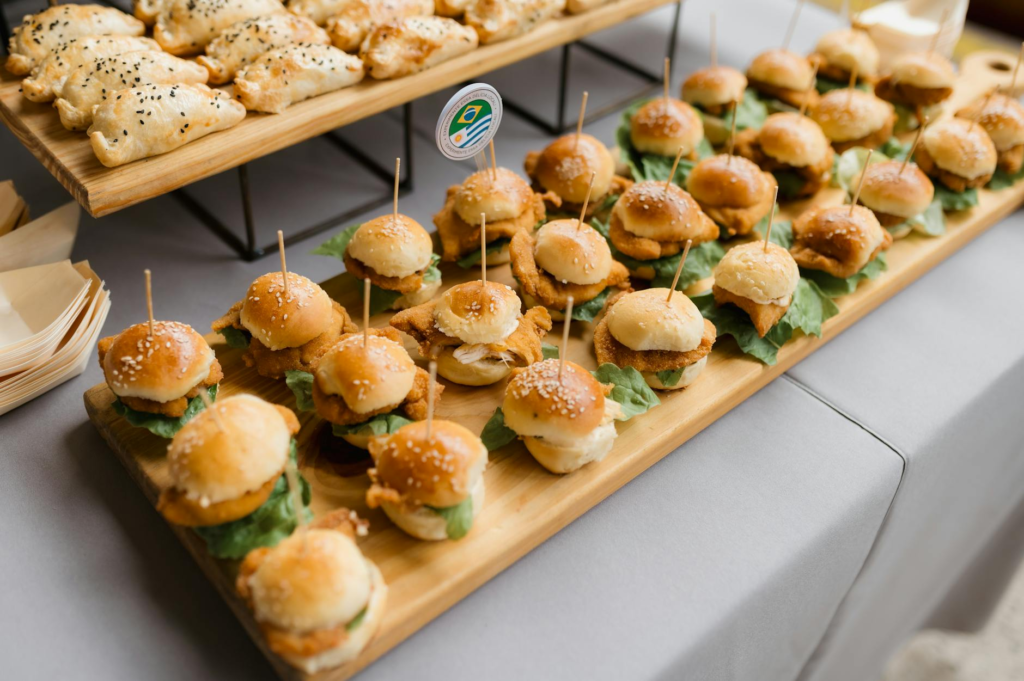 Creative slider toppings displayed on a wooden platter, showcasing color and texture. — cheeseburger sliders toppings