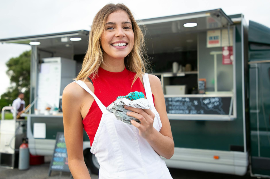 Customers enjoying street food burgers Vegas style at a food truck. — burger food trucks Las Vegas