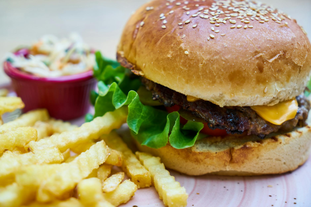 A close-up of a delicious burger with kid-friendly sides — family-friendly burgers Las Vegas