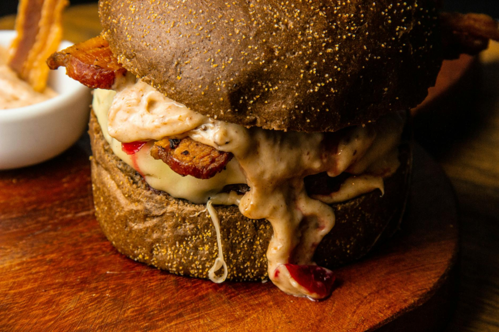 A close-up of a secret menu burger, showcasing its unique ingredients. — hidden gem burgers Las Vegas