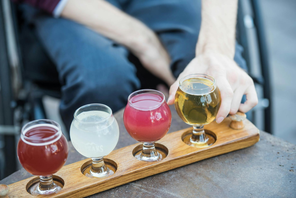 A craft brewery in Las Vegas with patrons tasting various beers and burgers. — burger and beer pairings Las Vegas