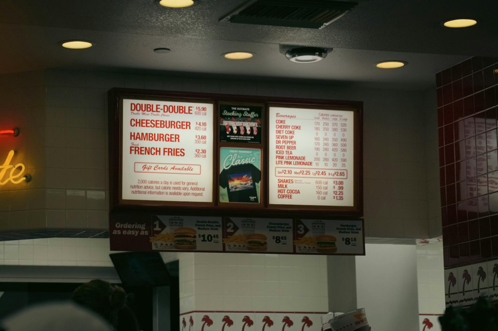 A vibrant burger menu board at a popular Vegas restaurant, enticing diners with creative options. — gourmet burgers Las …