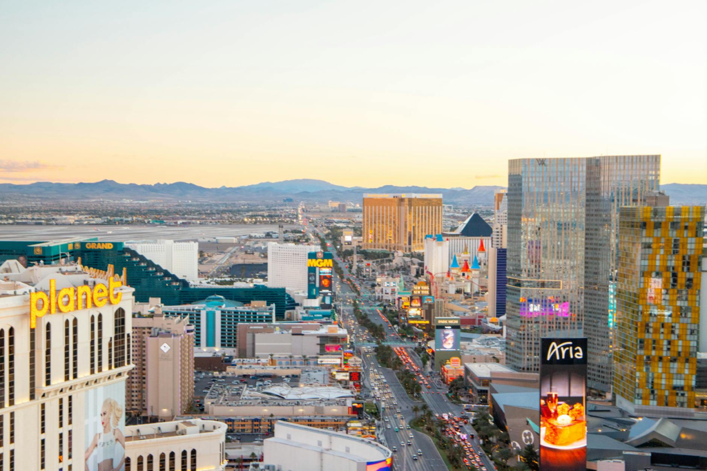 An aerial shot of the Las Vegas Strip showcasing the bright lights and bustling atmosphere, with a focus on dining options featuring burgers near Las Vegas Strip.
