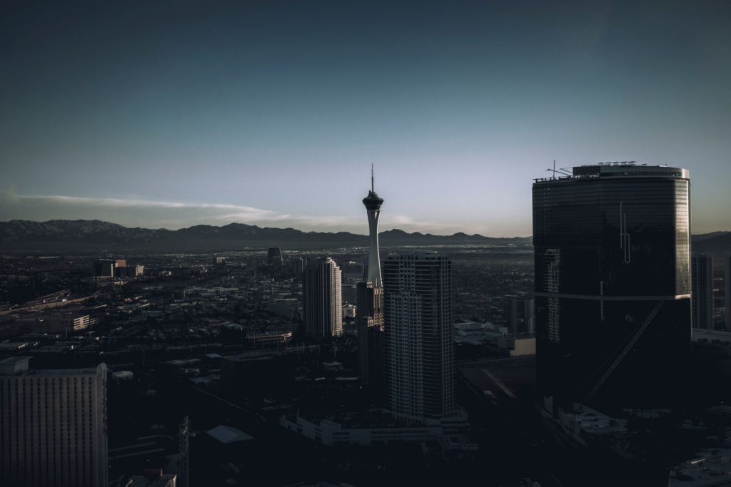 A beautifully plated gourmet burger with a sunset backdrop from a Las Vegas rooftop. — burgers with a view Las Vegas