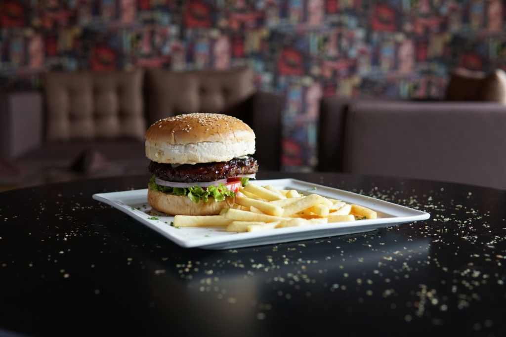 A classic American diner-style burger with fries on a retro table. — best burgers in Las Vegas