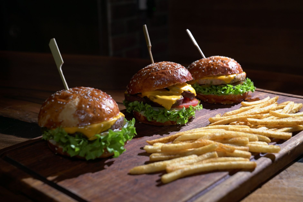 A close-up of a classic cheeseburger alongside fries, representing the average dining experience in Las Vegas. — burger …