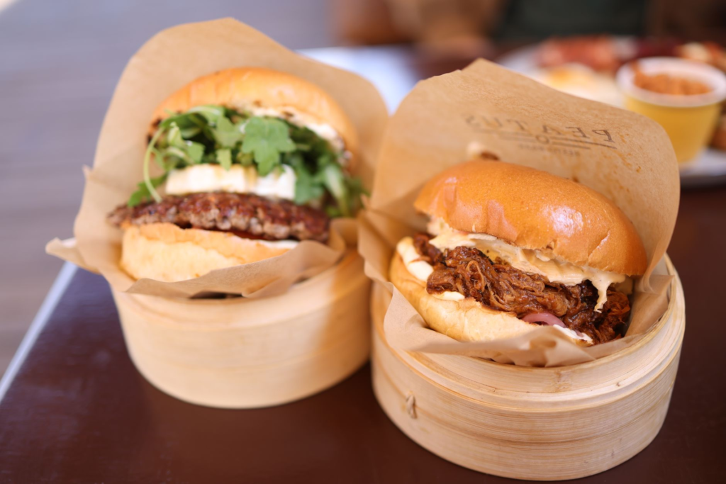 A close-up of a gourmet burger with unique ingredients, highlighting creativity in fast casual dining. — fast casual bur…