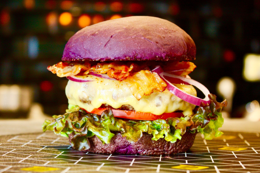 A close-up of a gourmet burger with unique ingredients, highlighting the creativity of Las Vegas dining. — burgers near …