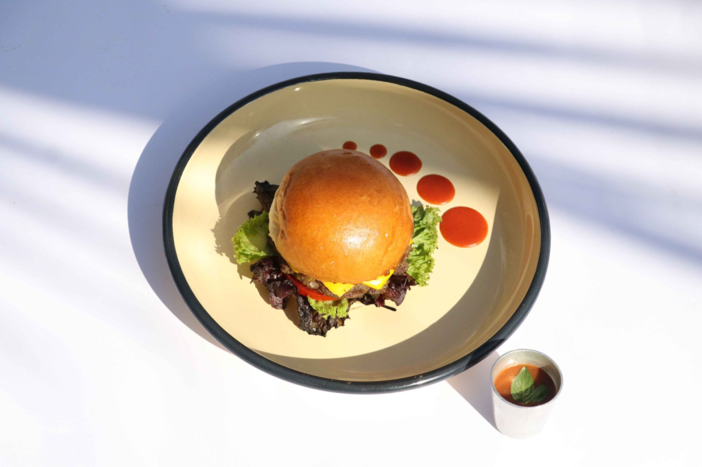 A colorful plate featuring a variety of vegan burgers from different restaurants — vegan burgers Las Vegas