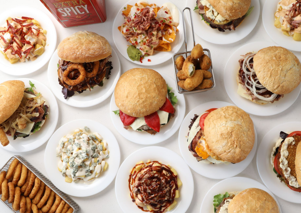 A colorful plate of cheeseburgers with various sides, highlighting the variety in Las Vegas. — best cheeseburgers in Las…