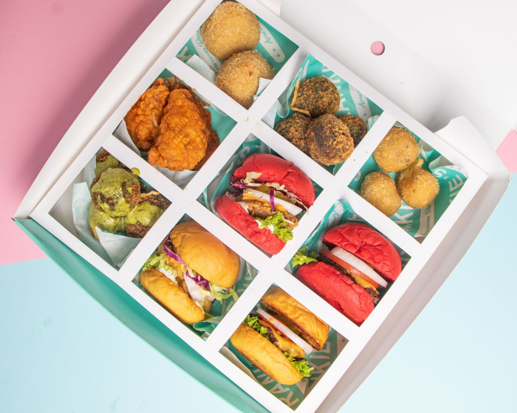 A colorful platter of assorted burgers showcasing different flavors and styles. — juicy burgers Las Vegas