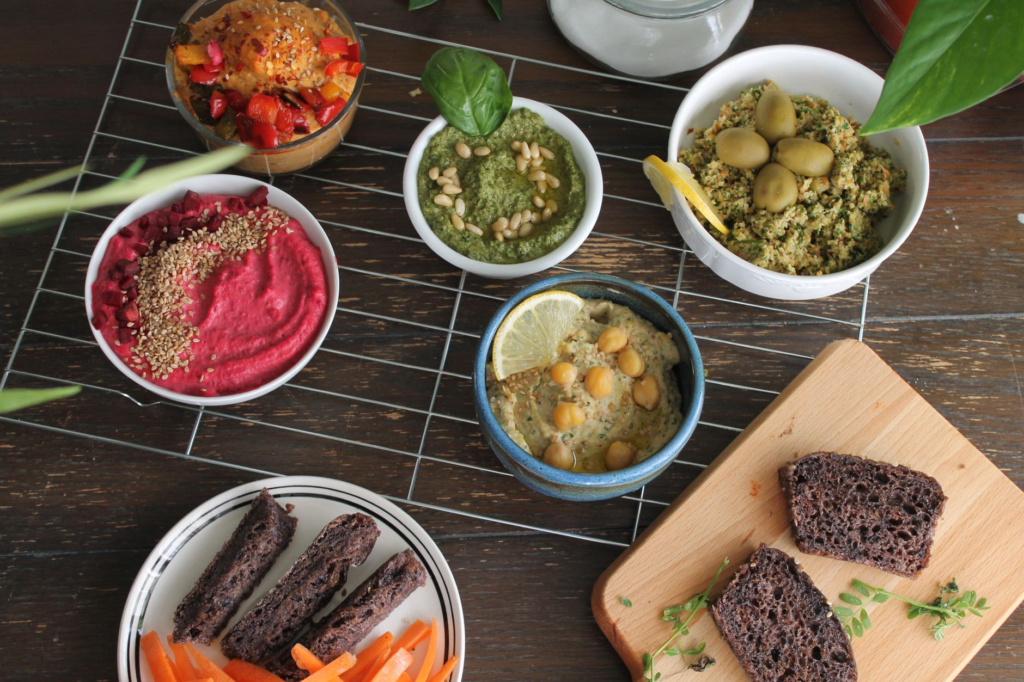 A colorful spread of various plant-based burgers on a table — vegan burgers Las Vegas