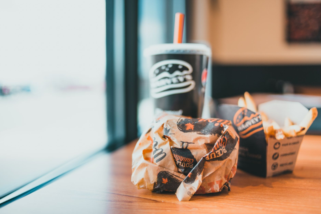 A delicious burger combo, featuring a burger, fries, and a drink, artfully arranged on a table. — burger deals Las Vegas