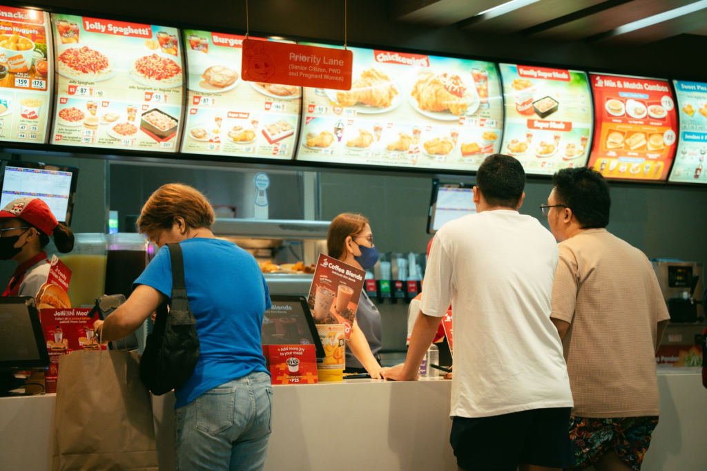 A family enjoying a meal at a busy Las Vegas burger chain. — burger chains Las Vegas