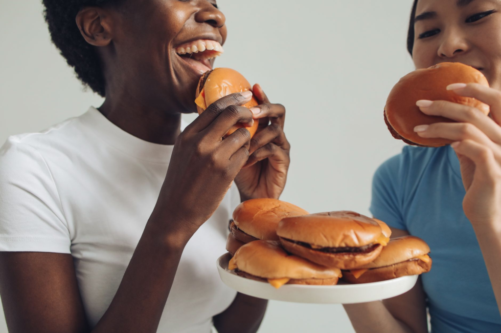A group of friends enjoying their burgers at a budget-friendly restaurant in Las Vegas. — affordable burgers Las Vegas