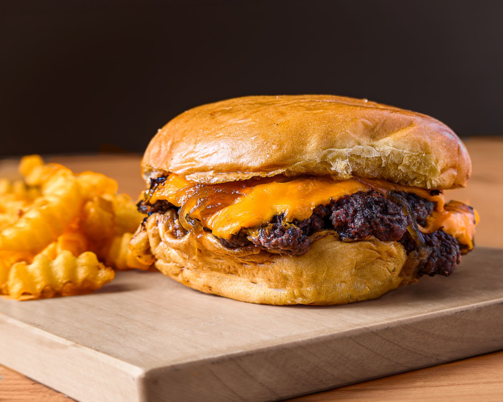 A mouthwatering affordable burger served with fries at a local Las Vegas diner. — affordable burgers Las Vegas