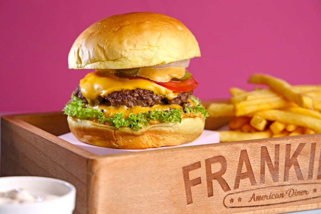 A mouthwatering cheeseburger with toppings and fries at a Las Vegas diner. — best cheeseburgers in Las Vegas