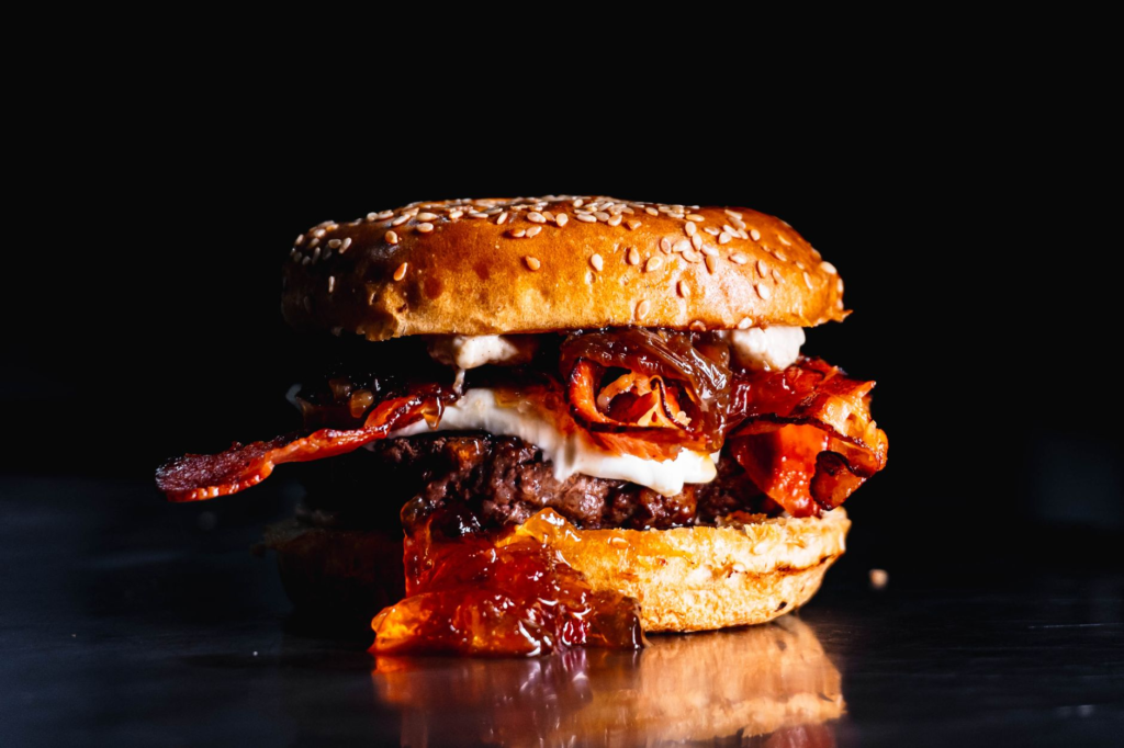 A mouthwatering gourmet burger with fresh toppings served at a popular restaurant near the Las Vegas Strip. — burgers ne…