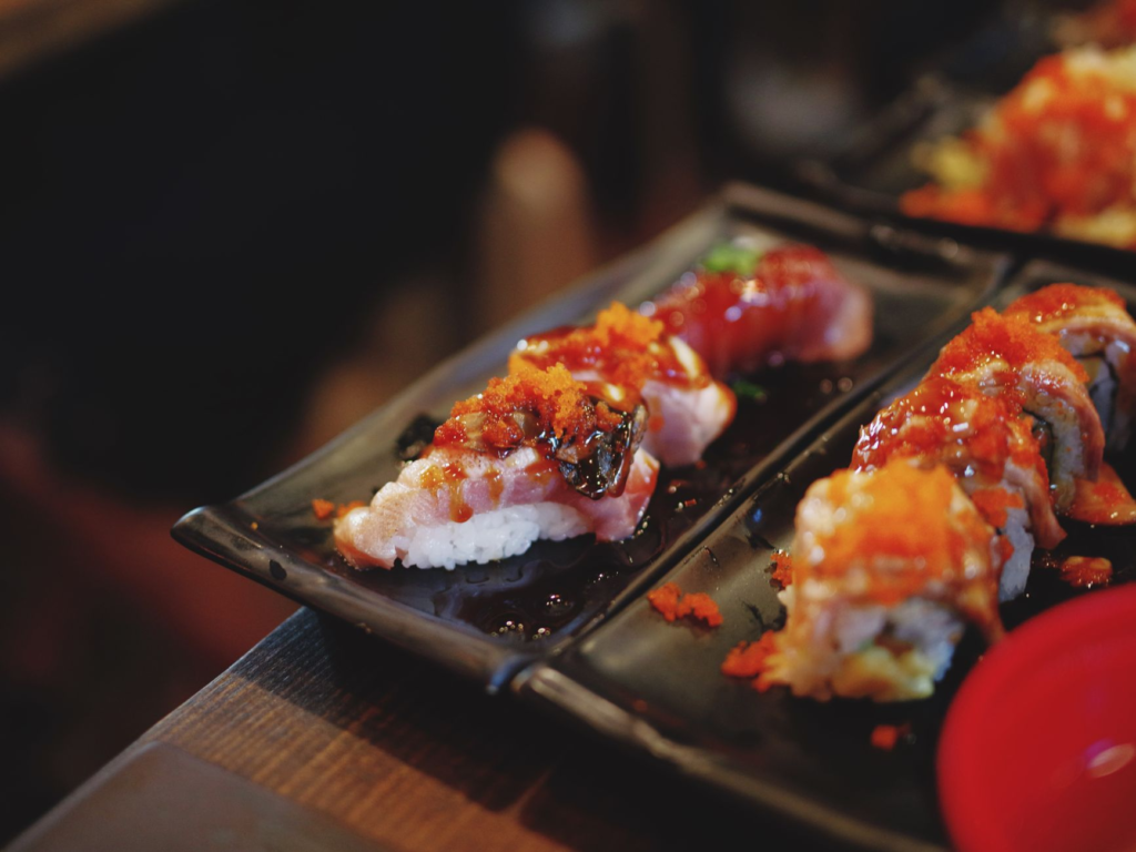 A mouthwatering view of the Sushi Burger at Sushisamba, featuring layers of fresh seafood and unique sauces. — unique bu…