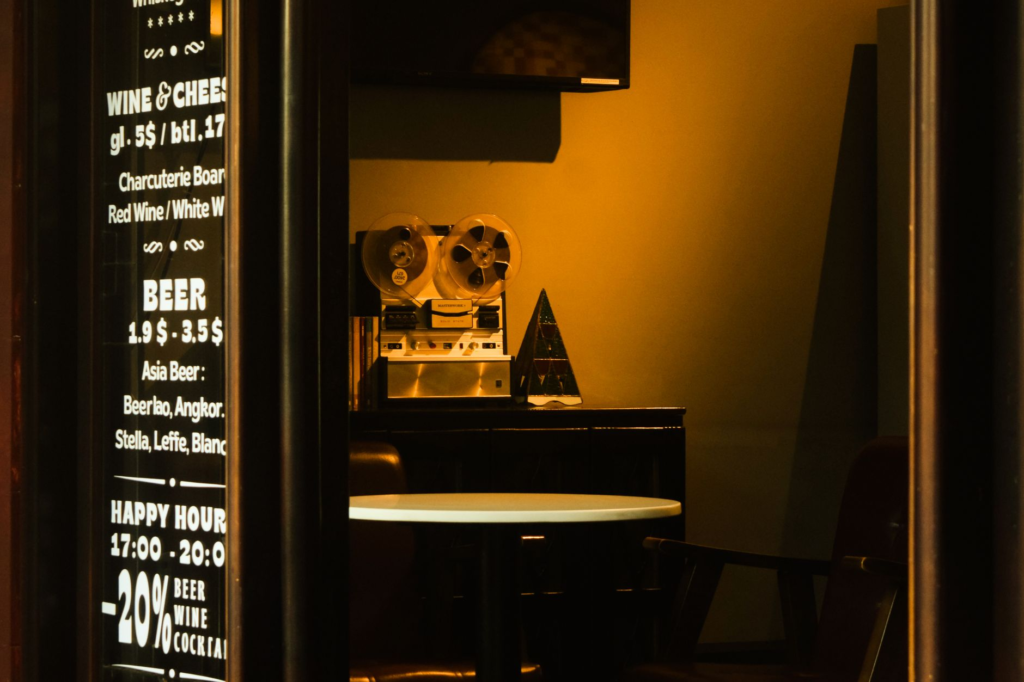 A promotional sign for happy hour burger discounts at a local bar — burger deals Las Vegas
