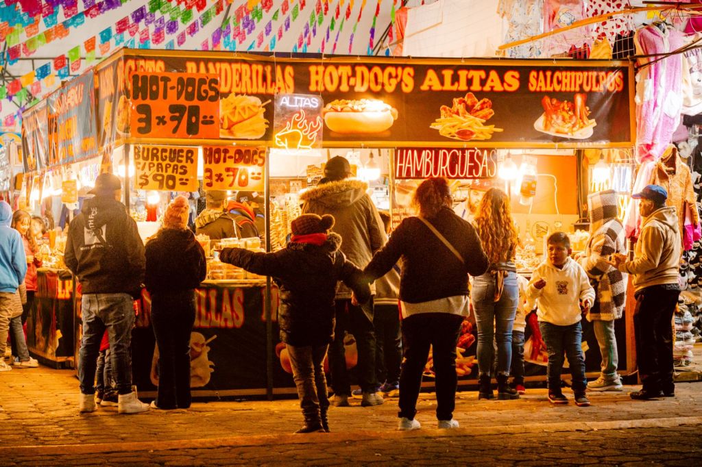 A vibrant food festival scene in Las Vegas, with food stalls and happy diners enjoying burgers. — iconic burgers Las Vegas
