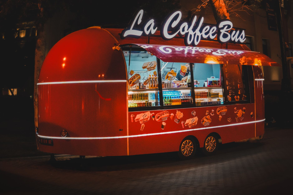 A vibrant nighttime street scene in Las Vegas showcasing food vendors and late-night diners — late-night burgers Las Vegas