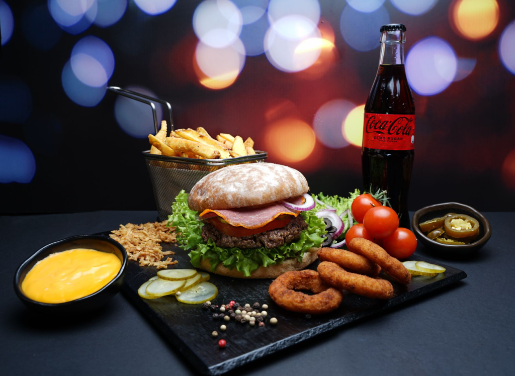 An In-N-Out Burger meal with fries and a soda against a vibrant backdrop. — burger joints Las Vegas Strip